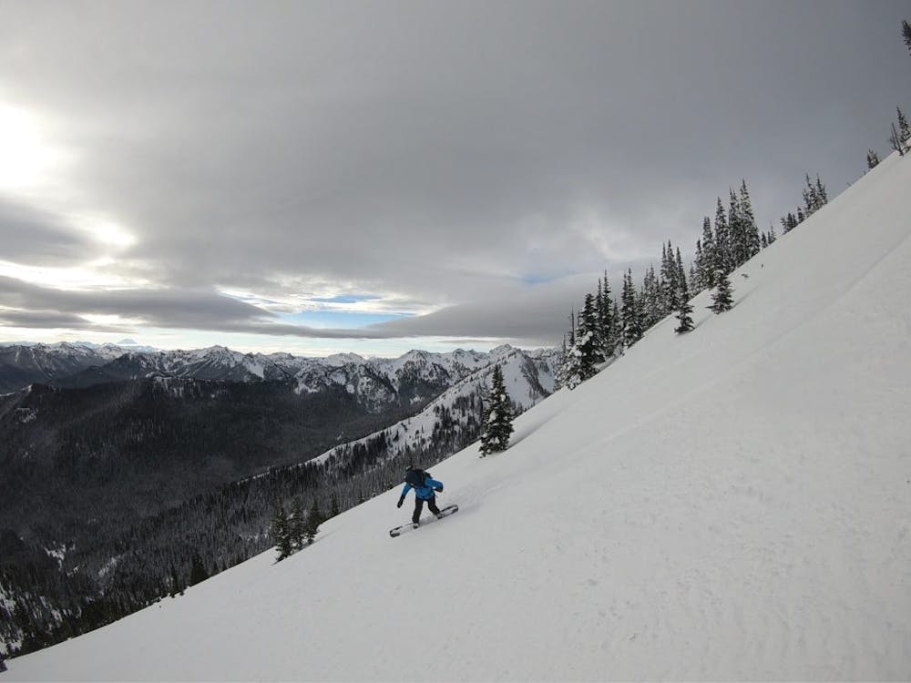 Snowboarding down the upper section of Crown Points South Slopes