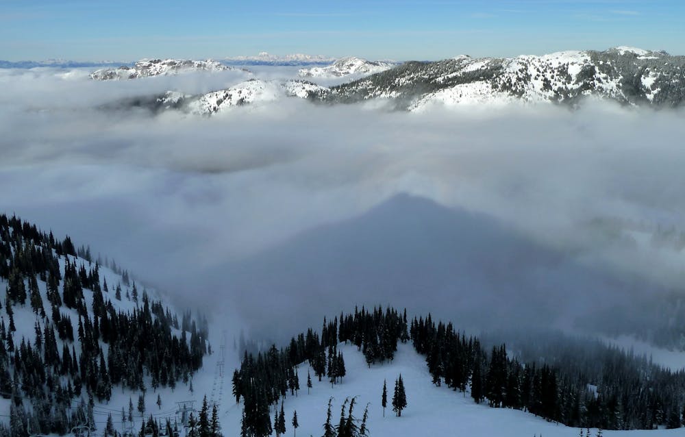 Northway Peak casts a shadow on valley fog, in sync with "Northway's nose."