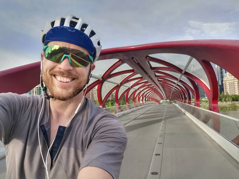 Author after crossing the Peace Bridge (over the Bow River) near downtown Calgary just a few kilometres from the end of the ride