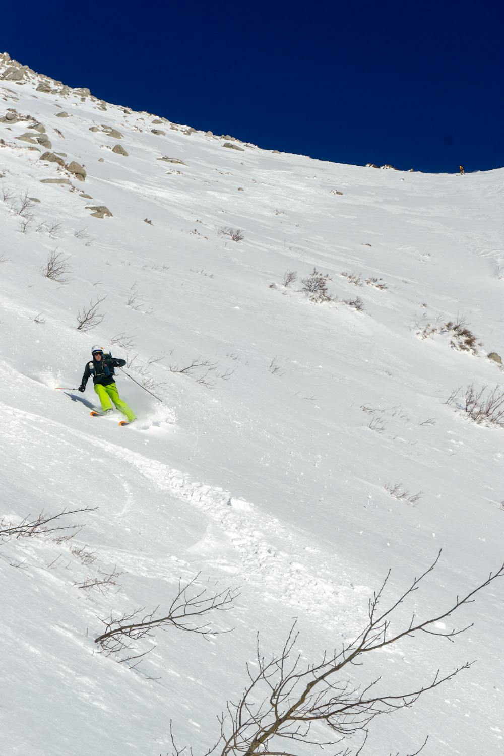 Skiing the southwest face in creamy pow conditions.