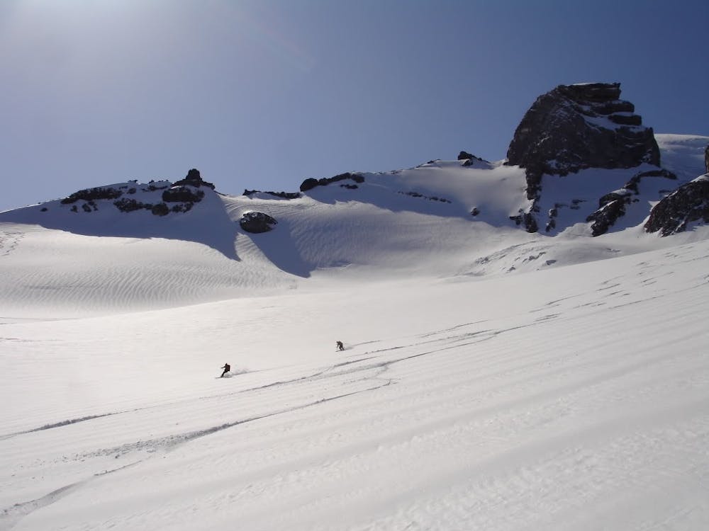 Skiing down the upper slopes of the Cowlitz Glacier