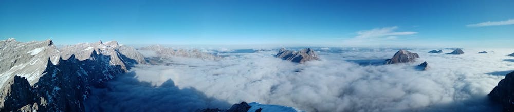 Cloud inversion over the northern Karwendel, as seen from the summit of the Laliderer Spitze.