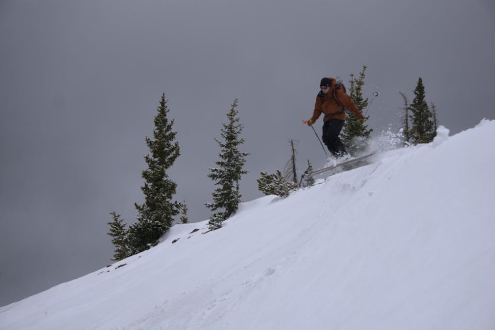 Zak skiing off the top of the bowl on a good spring day.