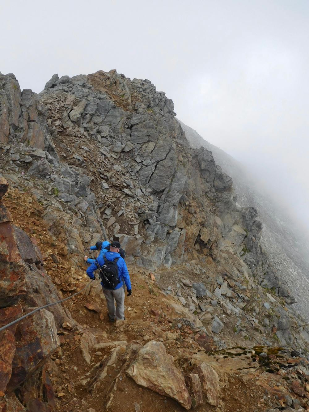 Descending the summit ridge