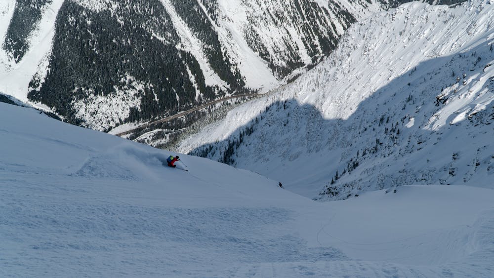 Freddy, charging down a steep couloir on the Cougar Creek West route, located in Rogers Pass, Glacier National Park, BC