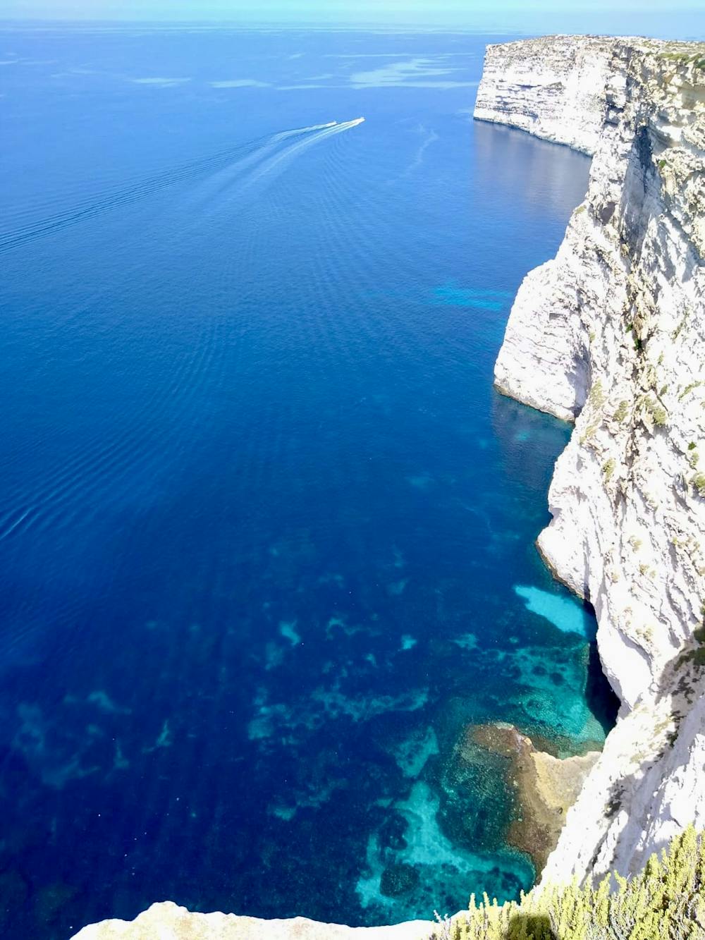 Perfect turquoise water beneath the Sannat Cliffs