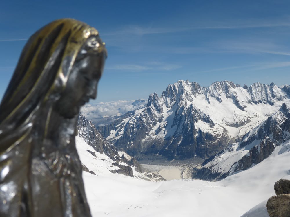 The summit Madonna enjoying her fantastic view over to the peaks of the Taléfre basin.