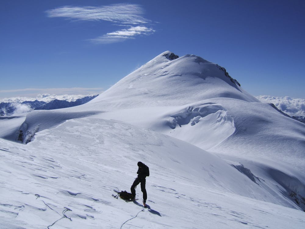 Andi Riesner near the summit of Maili Khokh. Mkinvartveri/Kazbek (5054 m) in the background. 