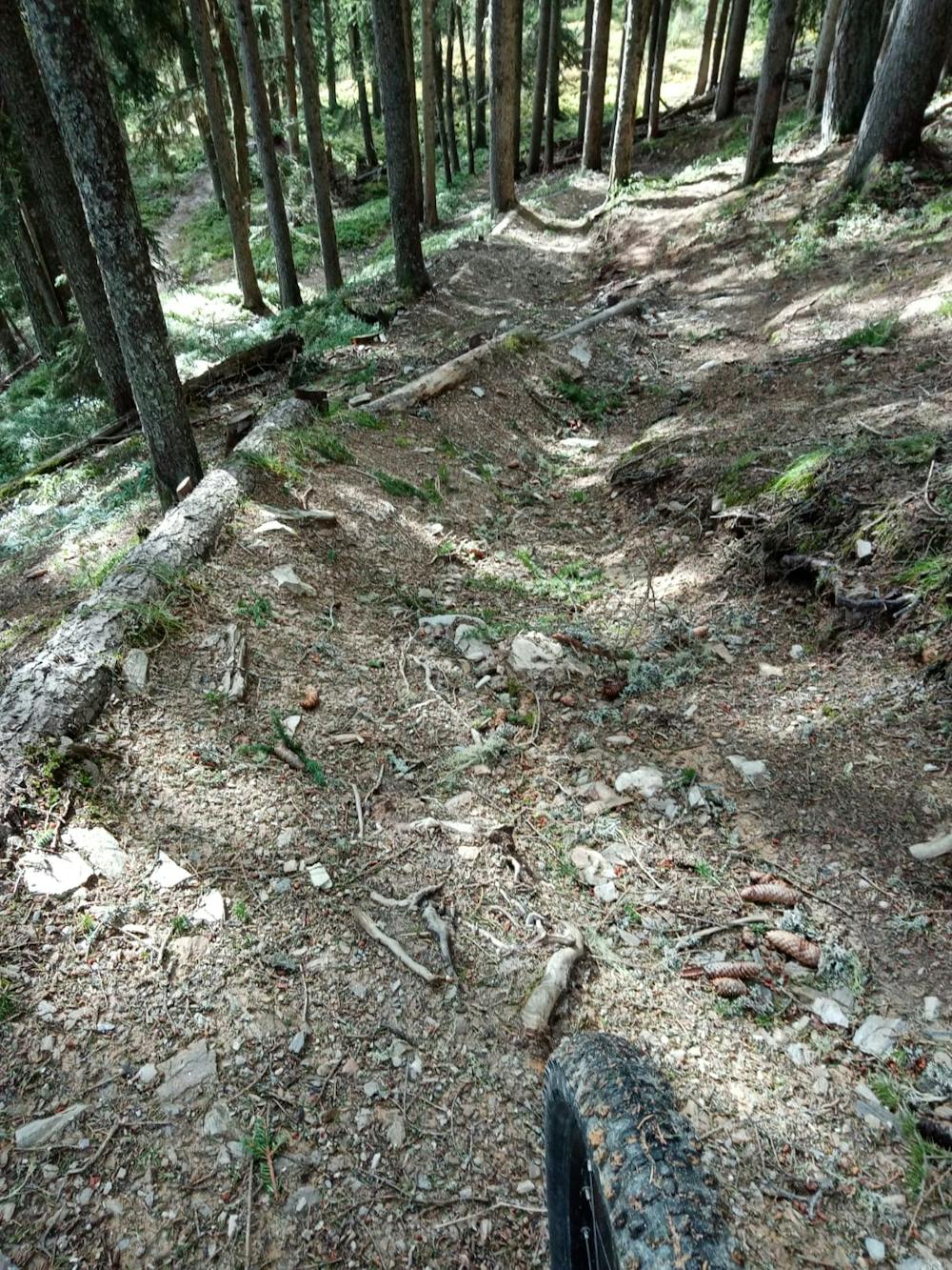 Typically steep and rocky terrain midway down.