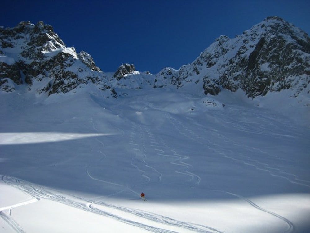 Skiing down the approach slopes on route to the Glacier du Mort.