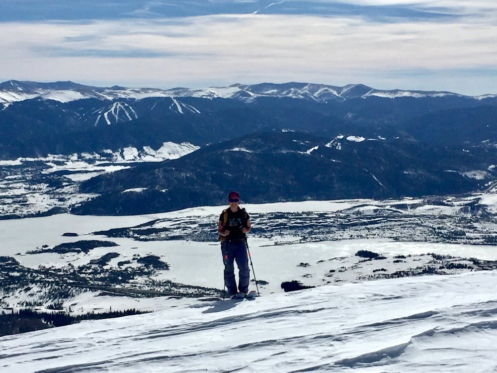 Skinning up above treeline with Lake Dillon and Keystone Ski resort in the background.
