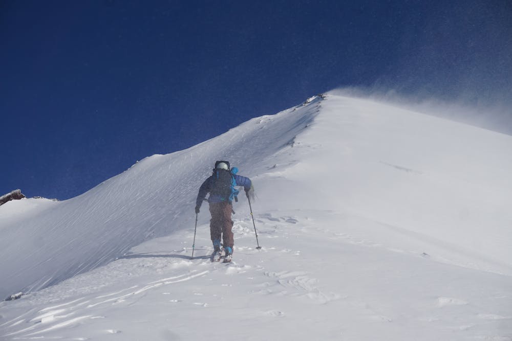 Skier skinning up the ridge (Normal Route)
