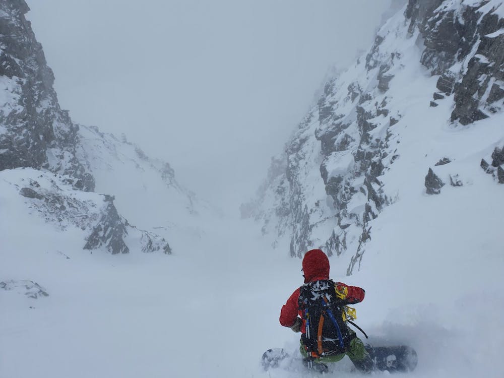 Dropping into the West Couloir of Rostafjellet in great powder conditions
