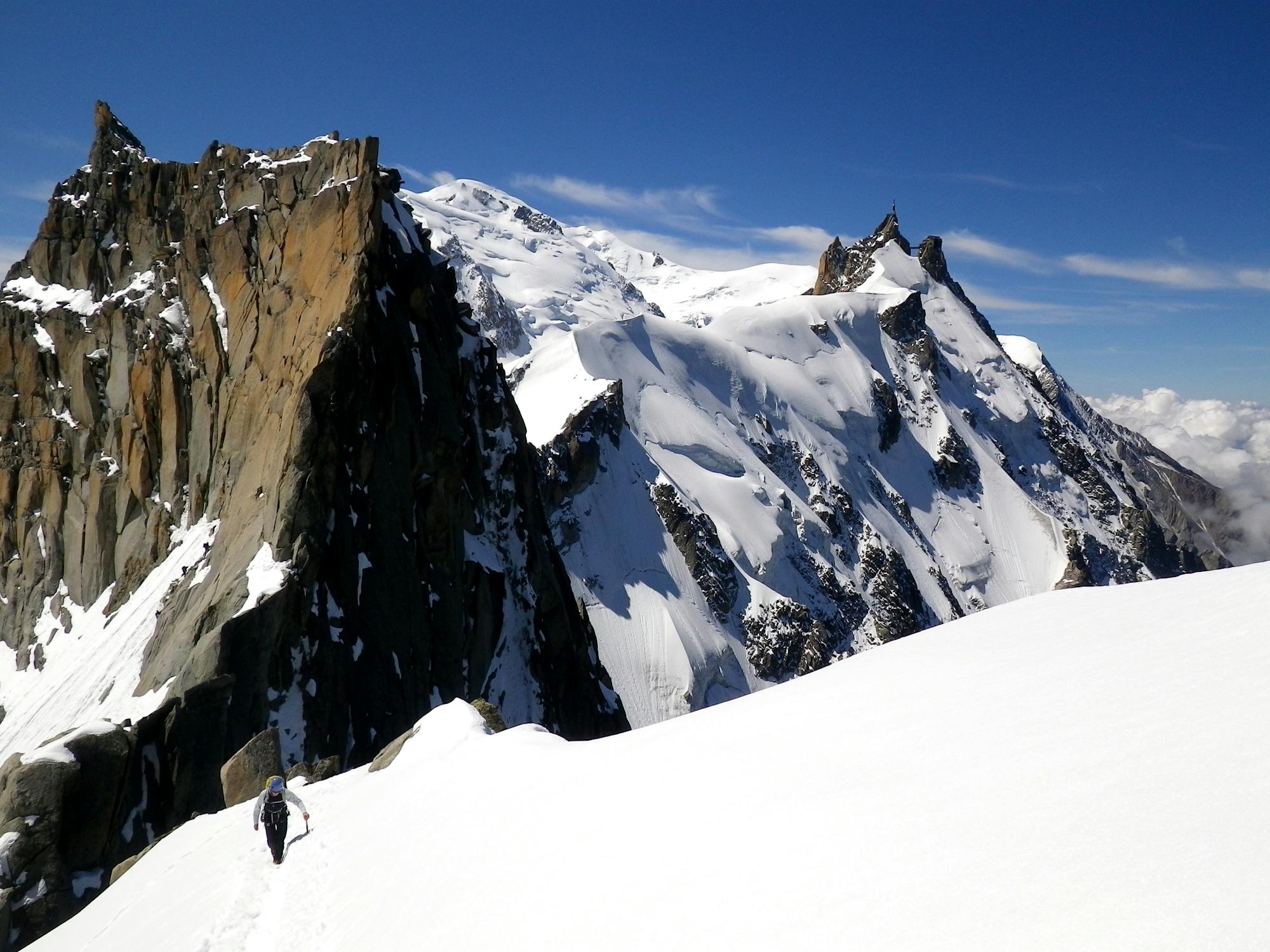 Climbing the final slope to the Aiguille du Plan summit tower.