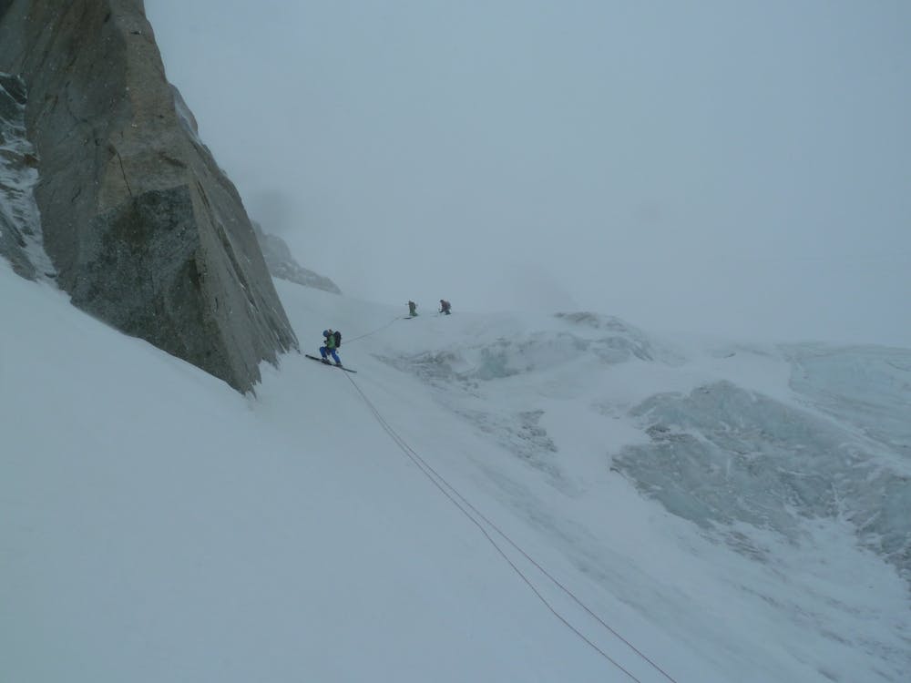 The upper abseil over the near permanent streak of black ice near the top. Under exceptional conditions it is possible to ski through without the rope here.