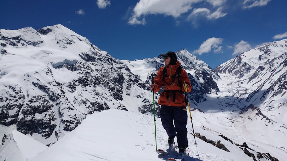 Dr. Neumann on the summit ridge, with the imposing Cerro Morado behind him.
