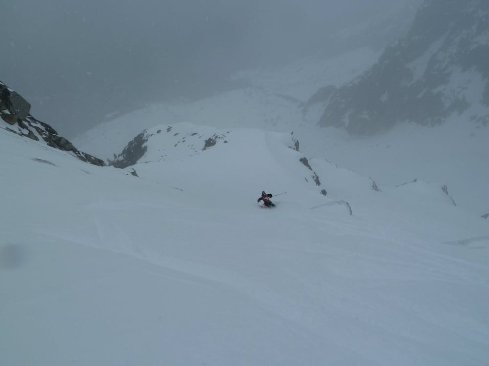 Skiing in the middle of the Glacier des Nantillons after descending the Contamine Couloir 