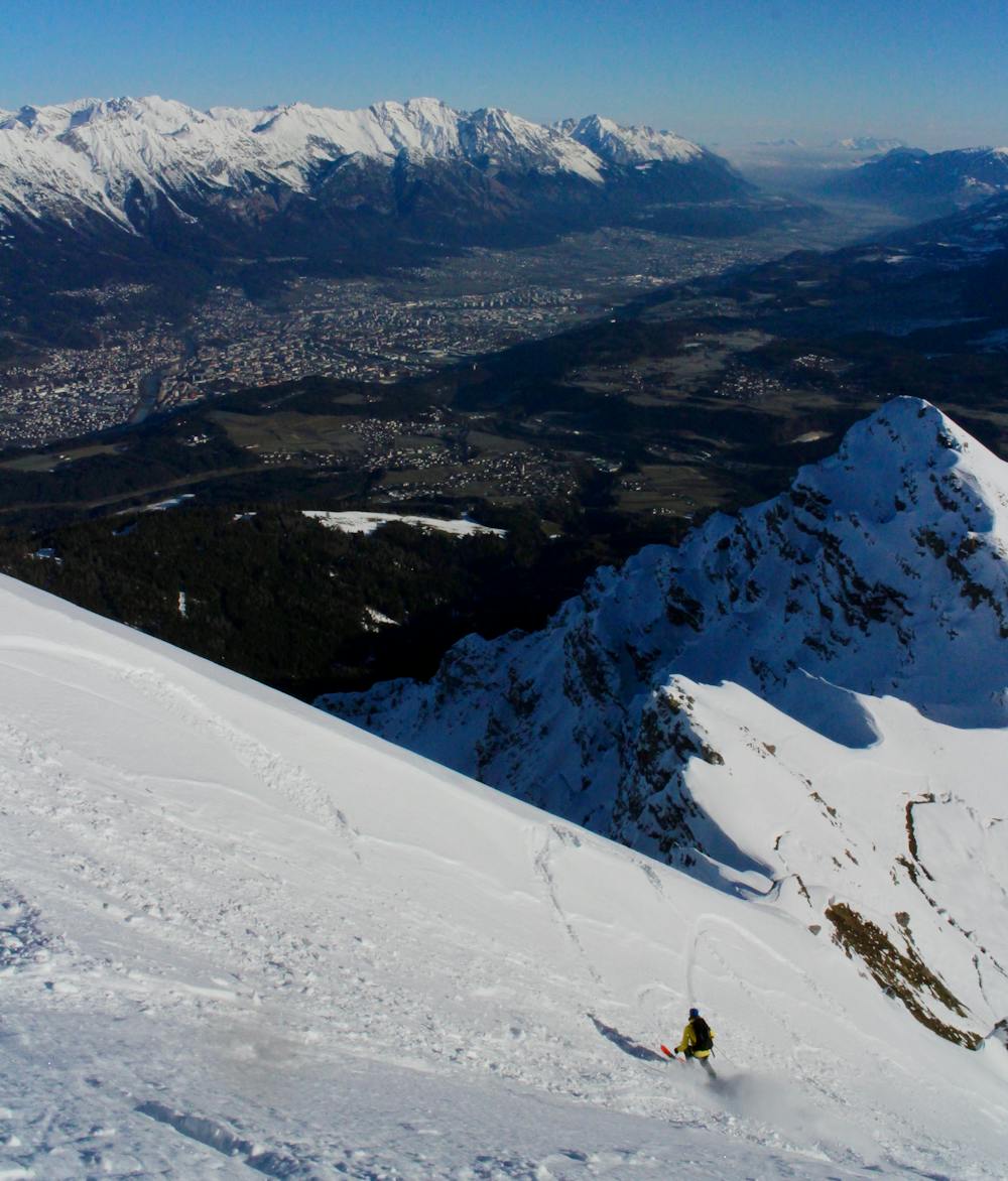 First turns off the summit, with Innsbruck visible far below.