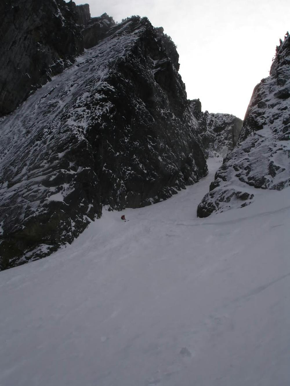 Skiing down the Slot Couloir