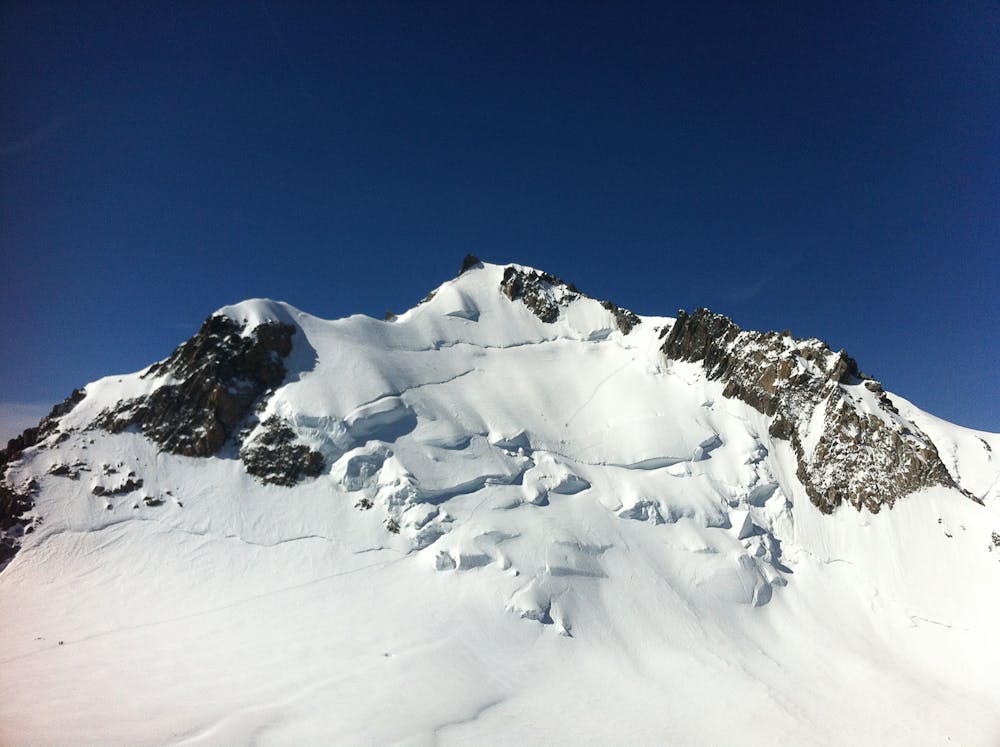 N Face of Mont Maudit, showing climbers heading up to the shoulder