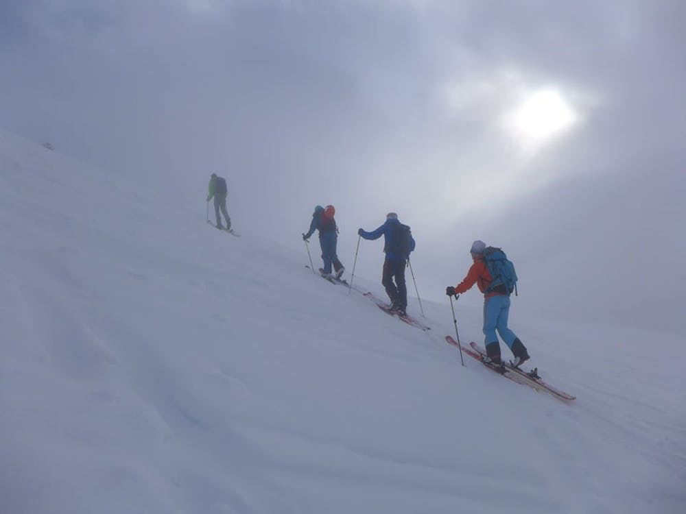 Skinning up the summit slopes of Pointe de la Pierre.