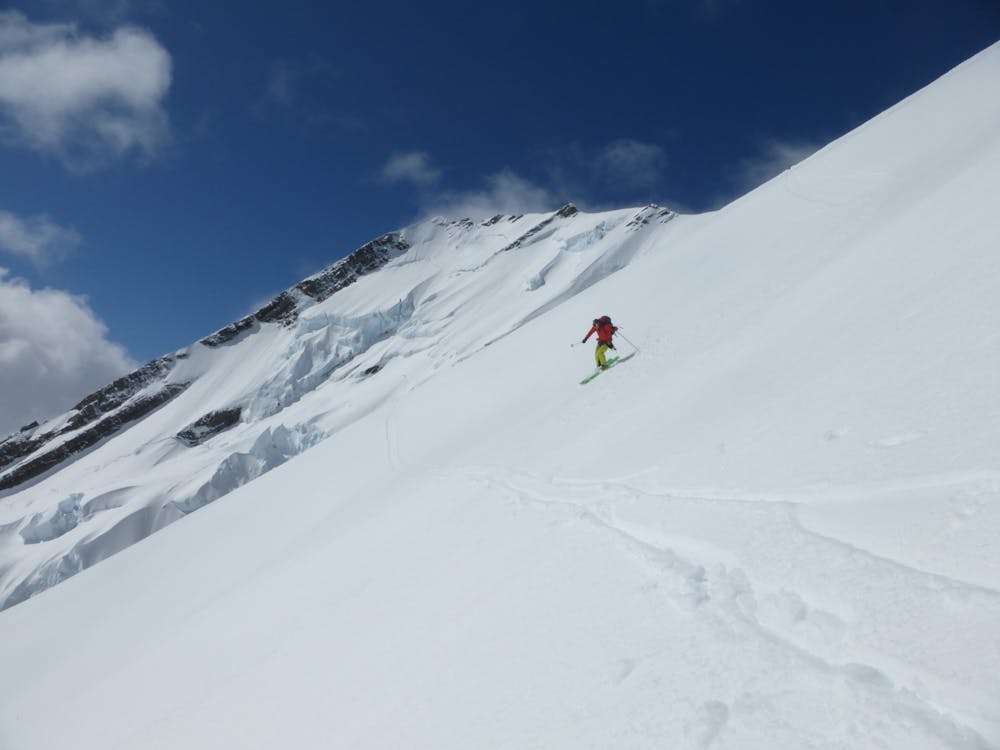 Skiing down the west flank of the mountain. 