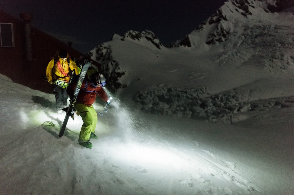 Nadine Wallner & Sam Smoothy setting out in a blizzard to ride the East Face of Mt. Cook