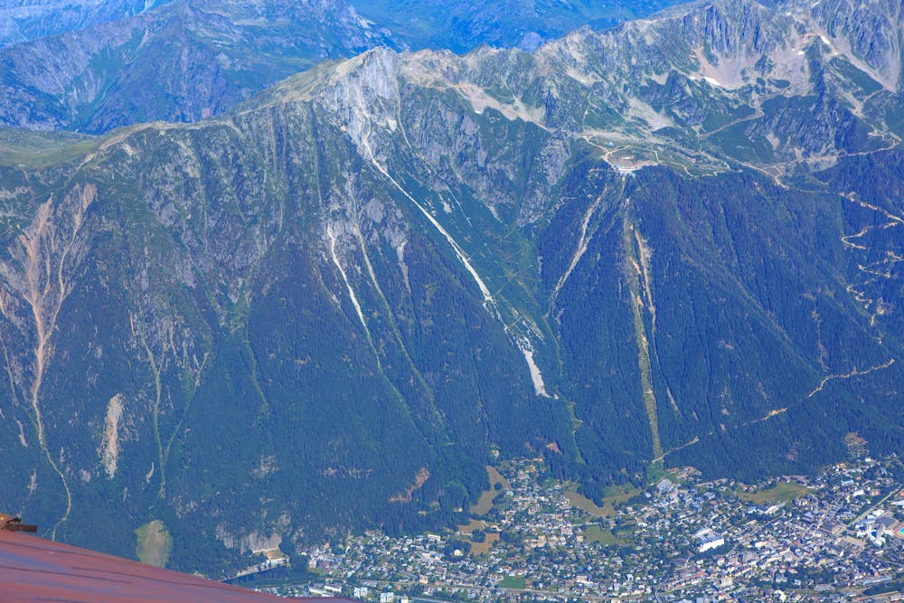up Aiguille du Midi...le Brevent (2525m) at center, refuge de bel Lachat at left, spiral trail down into Chamonix