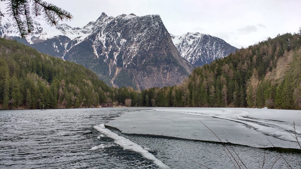 The lake partially frozen in autumn