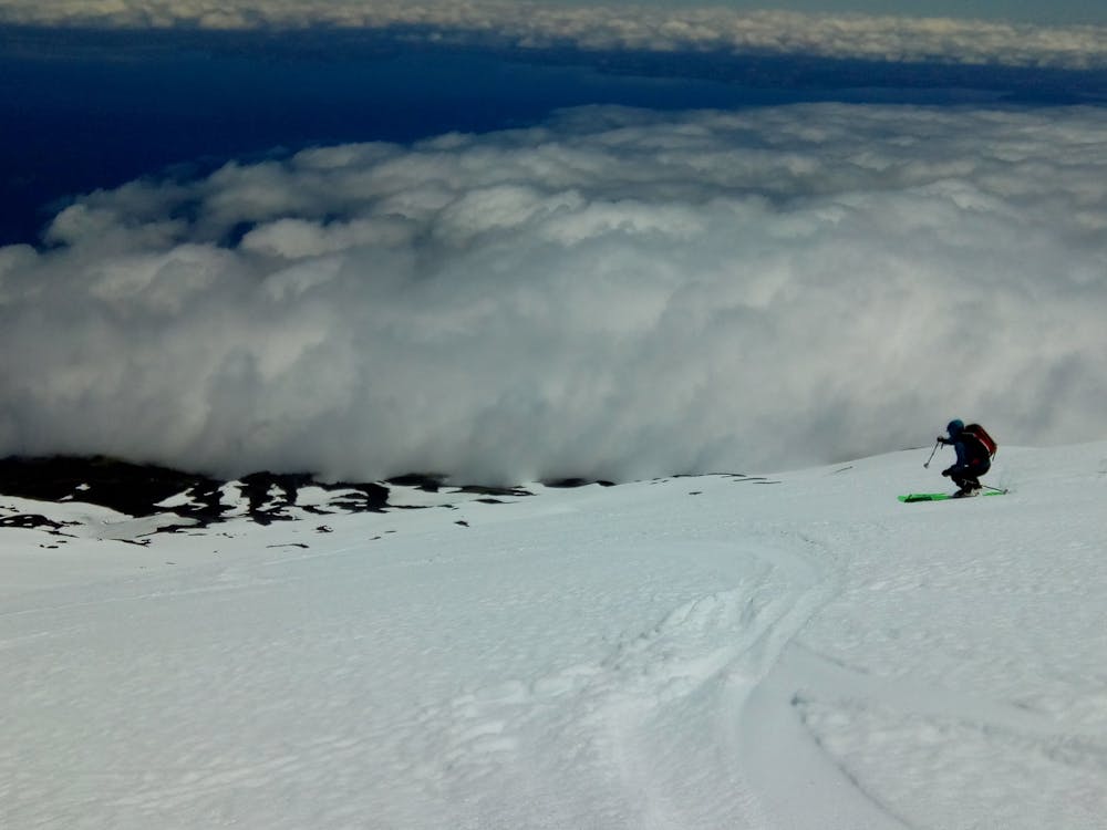 Skiing down to the clouds.