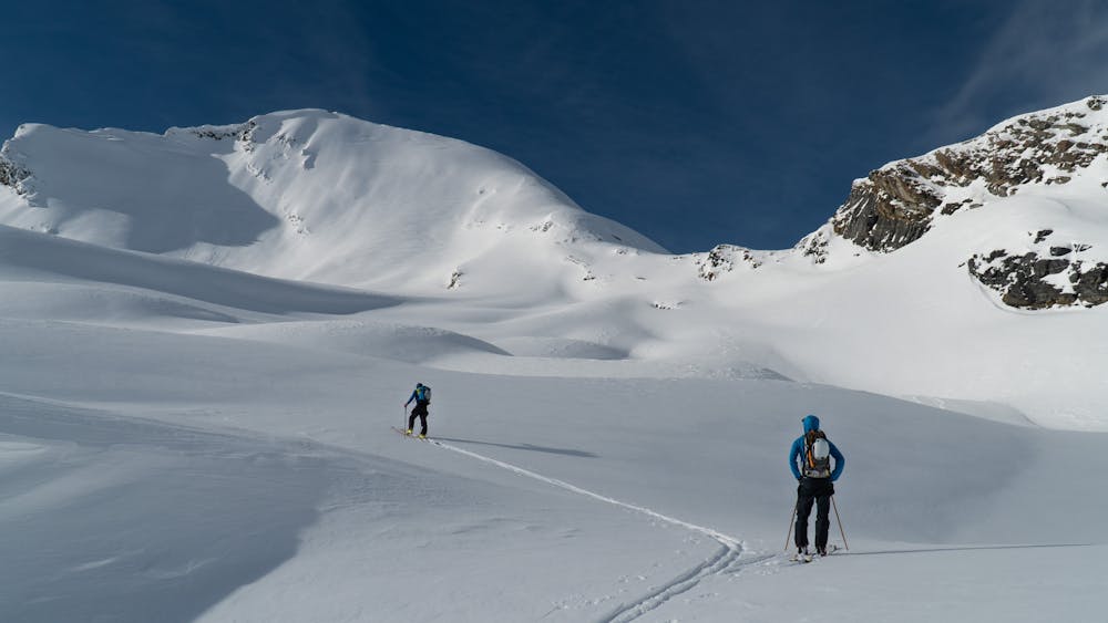 Two skiers touring up Catamount Pass on their way to ski the east face
