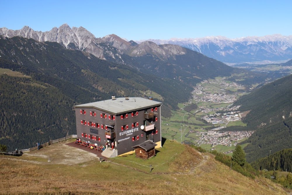 Looking down on the Elferhütte with the Stubai valley laid out below
