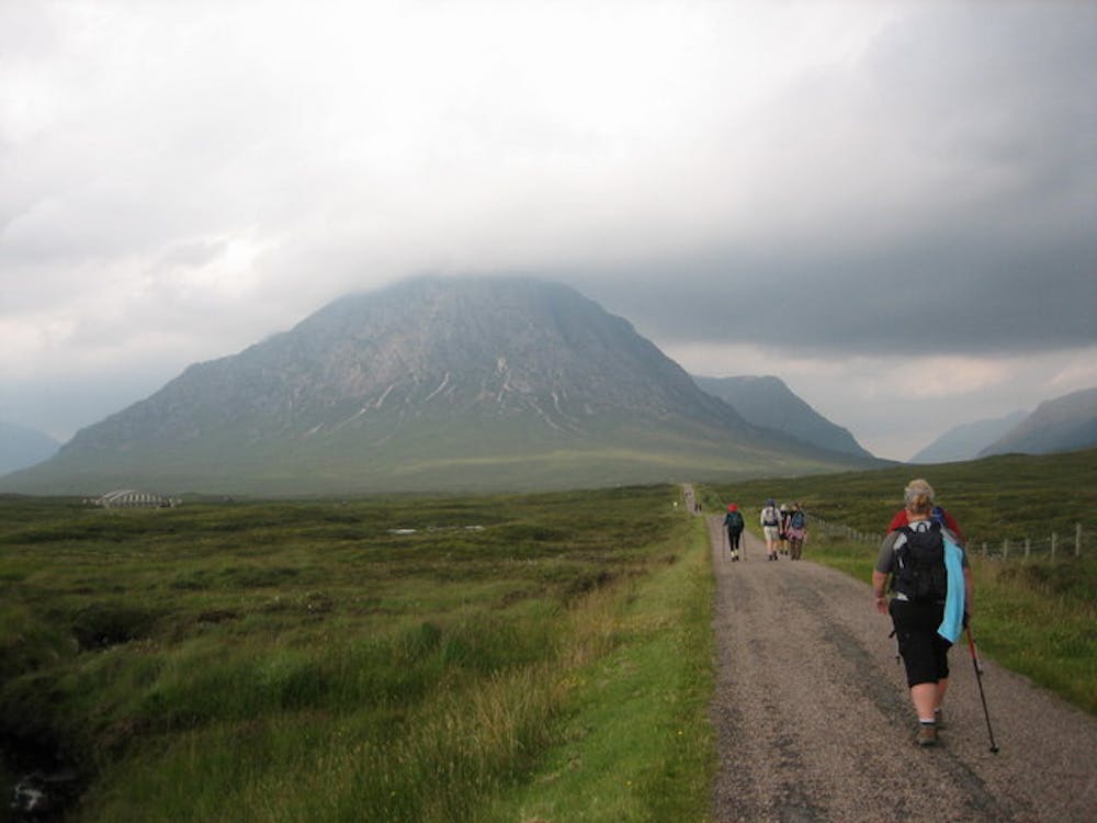 Walkers on the West Highland Way with Buachaille Etive Mor in view