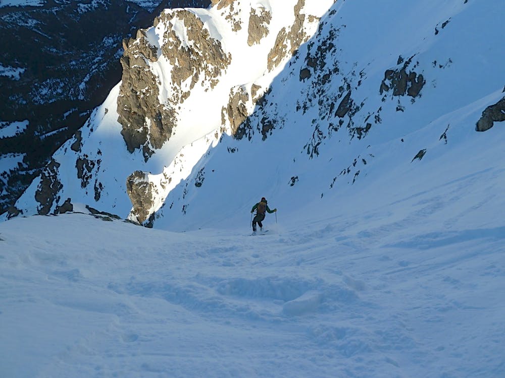 Steep and exciting turns in great snow at the top of the couloir.
