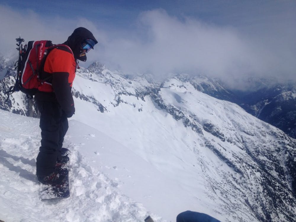 Preparing to snowboard of Sahale Peak
