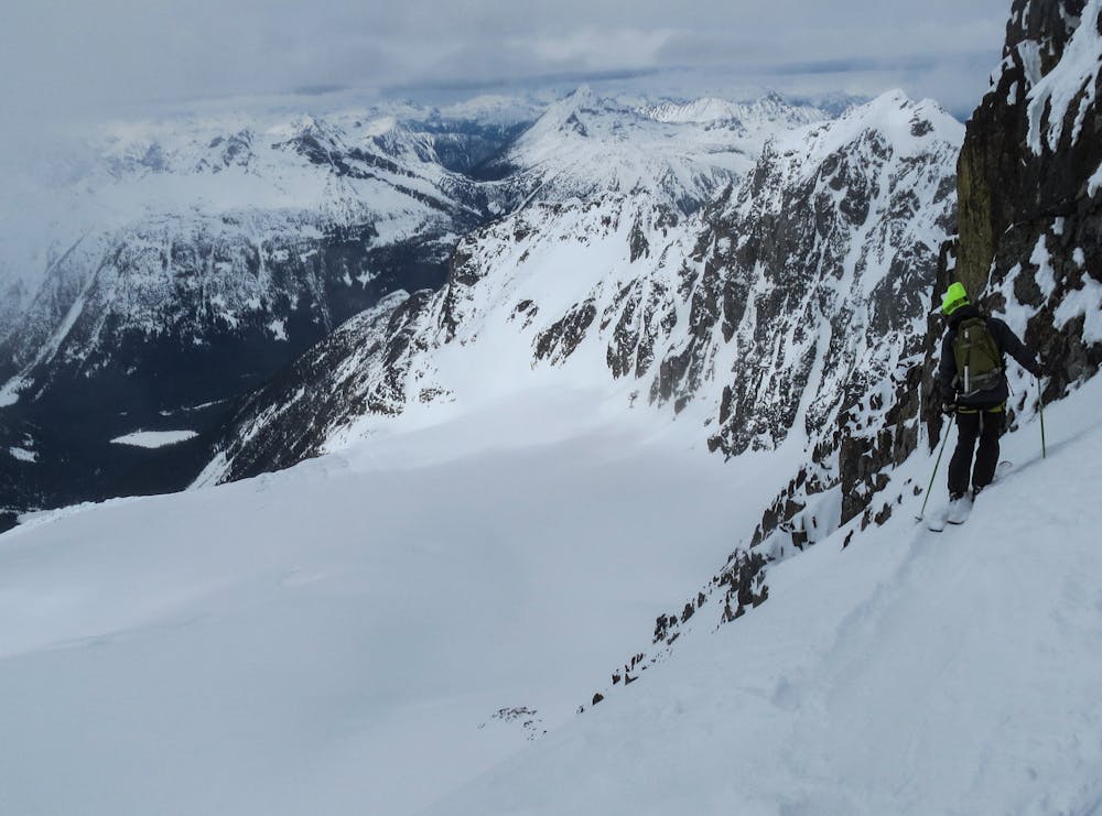 A skier about to drop into the NW Face with Joffre's Aussie Couloir in the background.