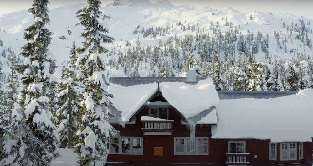 Journeyman Lodge with route and ski terrain in Background