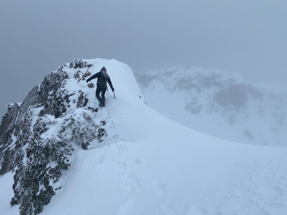 A less lovely day in winter along the summit ridge