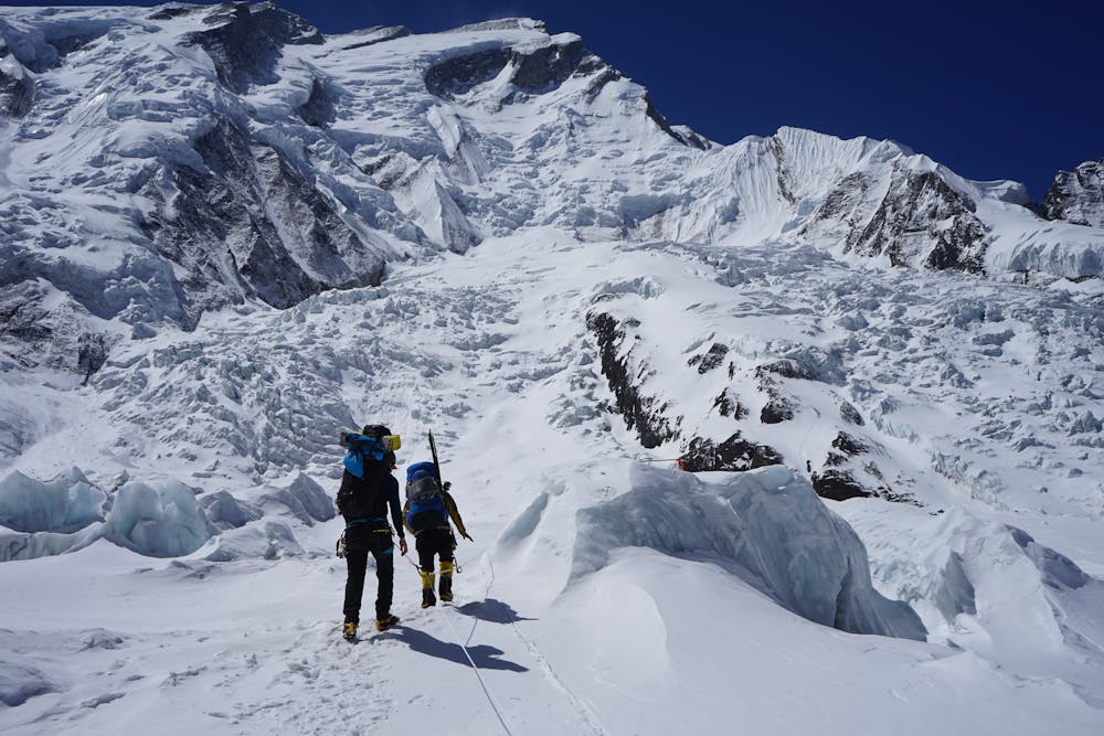 Hakon and Sonam crossing the glacier before making the uphill climb towards Camp 2