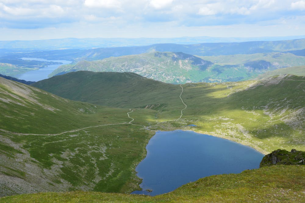 Ullswater can be seen in the distance while atop Helvellyn.