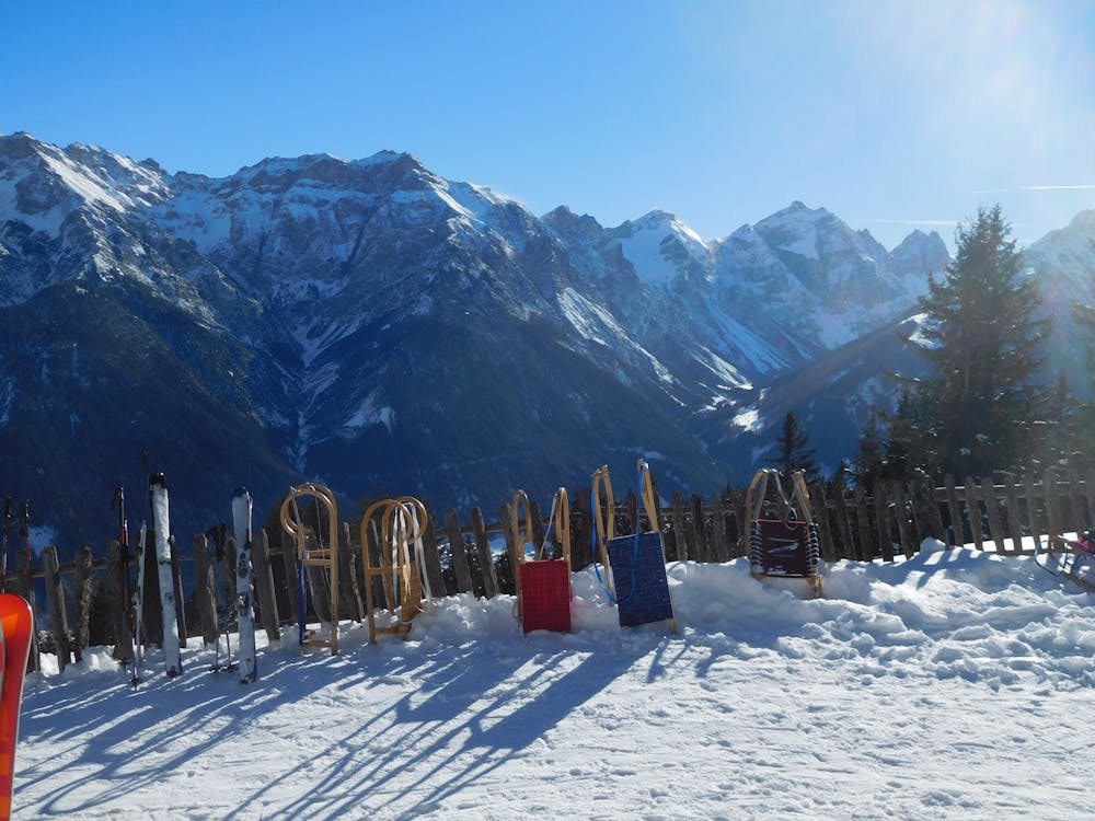 Sledges and a wonderful backdrop at the Ganalm.
