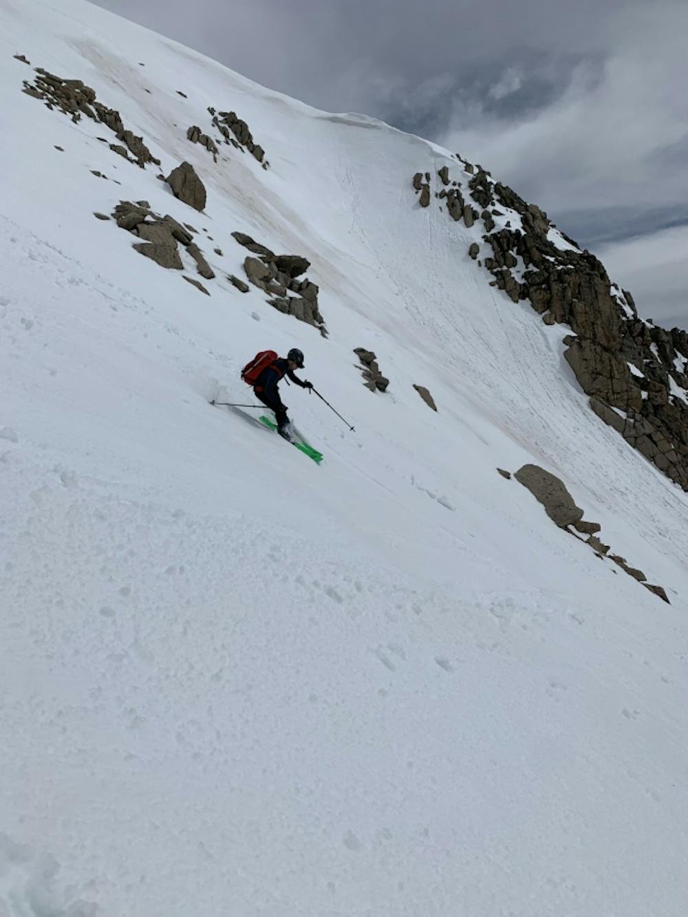 Evan skiing down the steeper part of the face.