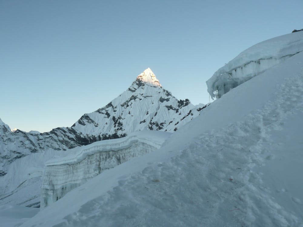 The first rays of light kissing the summit of Ama Dablam