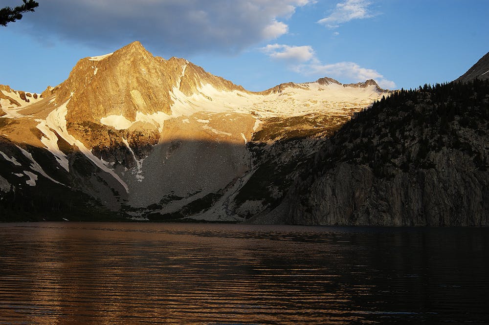 Sunset light on the mountain, seen from Snowmass Lake