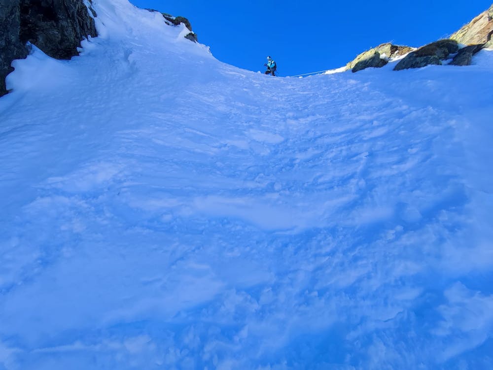 Looking up the chute in hard packed snow.