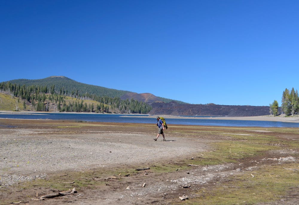 Backpacker near the shore of Snag Lake