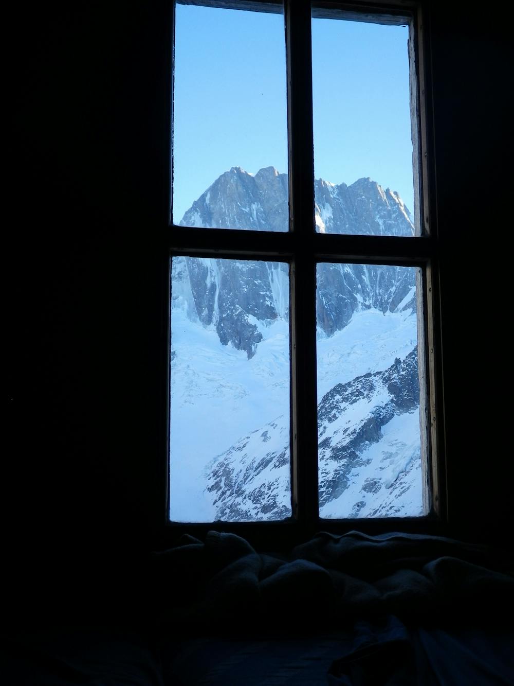 Looking out of the Couvercle hut window at the north face of the Grandes Jorasses.