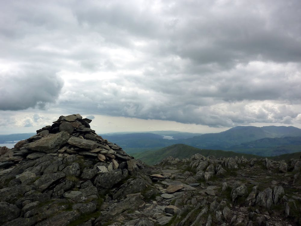 The summit cairn of Hart Crag. With a view over to Great Rigg