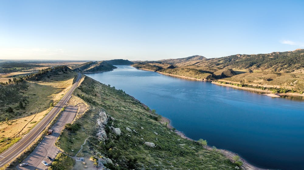 Horsetooth Reservoir. The trail is on the hillside to the right.