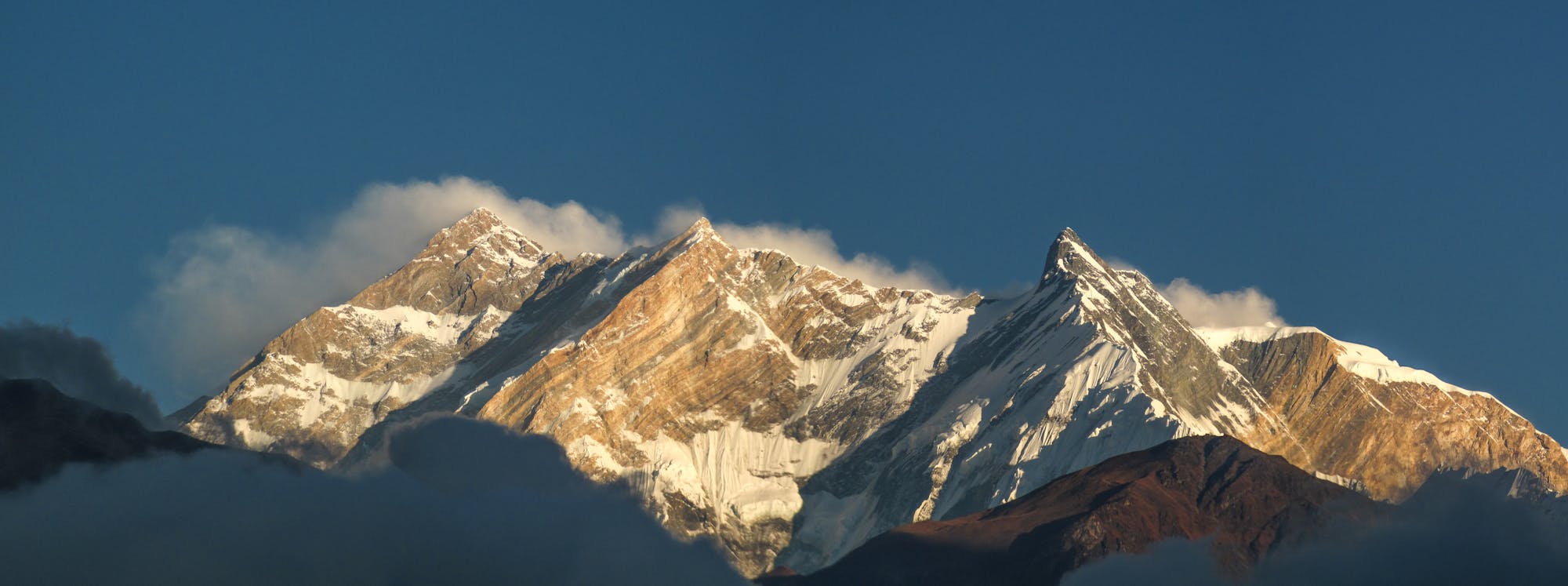Three peaks bathed in the afternoon sun on the back half of the Annapurna Circuit.